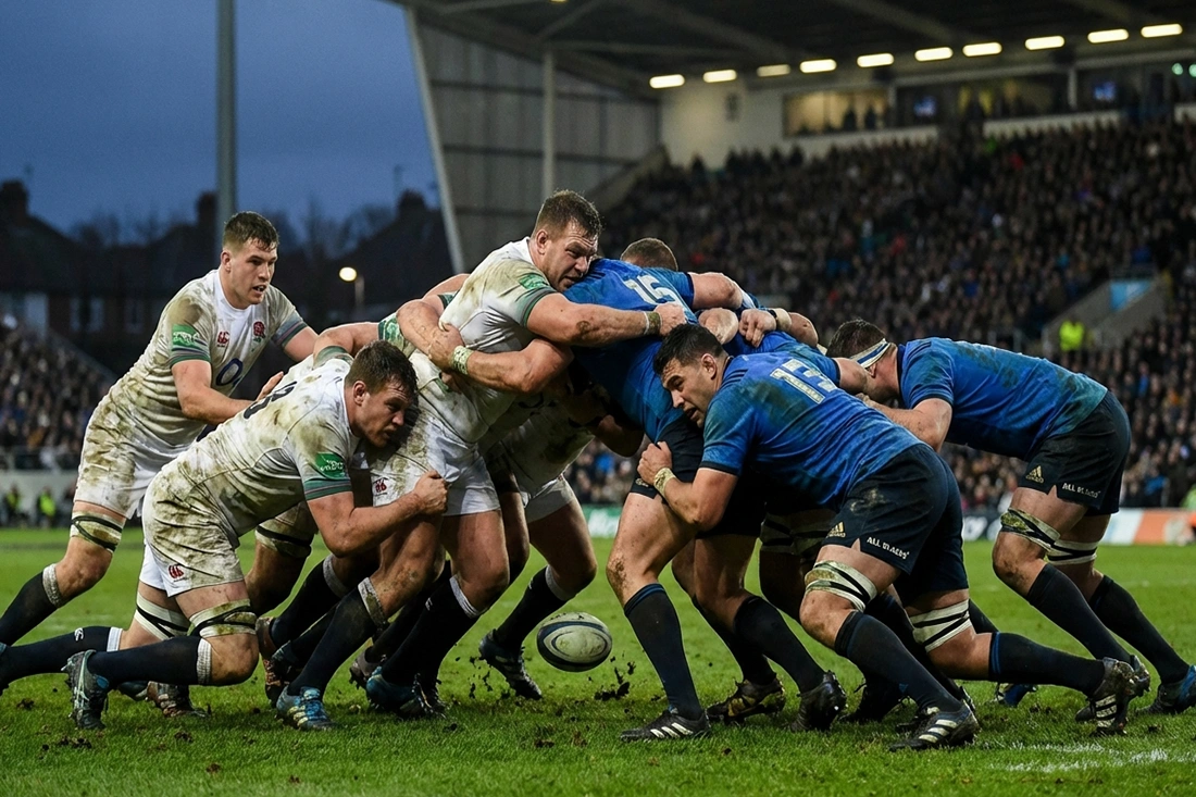 Intense rugby scrum showing physical contest with dominant pack driving opponents backward